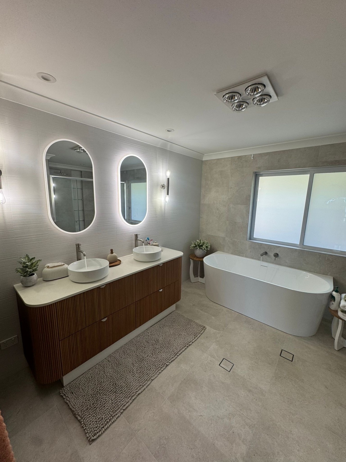 Master bathroom with freestanding tub and double vanity